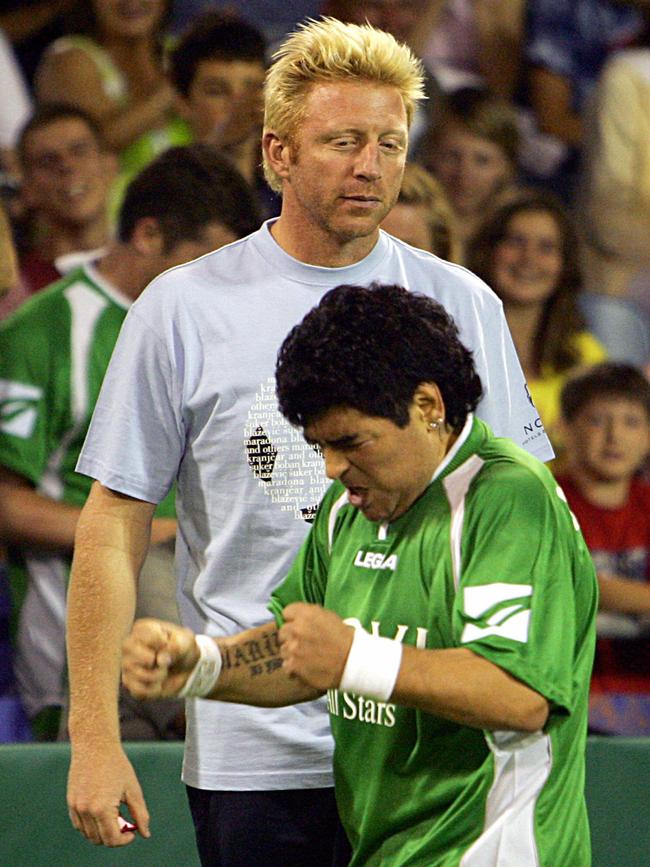 Maradona on the pitch with tennis legend Boris Becker during a charity soccer match in 2005.