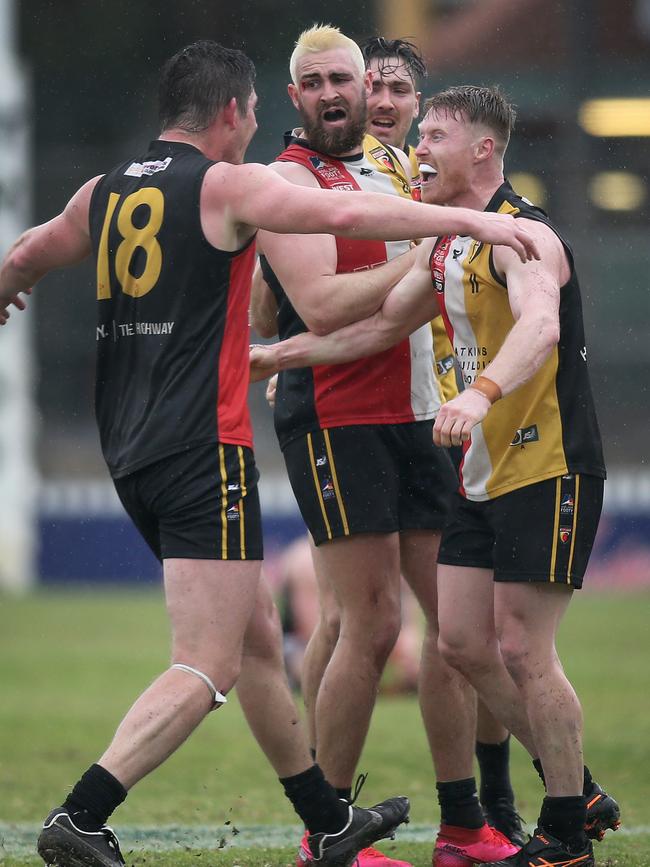 Saints players celebrate winning last year’s division one grand final. Picture: Dean Martin