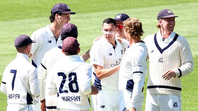 MELBOURNE, AUSTRALIA - OCTOBER 21: Scott Boland of Victoria is congratulated by team mates after taking the wicket of Sam Konstas of New South Wales during the Sheffield Shield match between Victoria and New South Wales at Melbourne Cricket Ground, on October 21, 2024, in Melbourne, Australia. (Photo by Josh Chadwick/Getty Images)