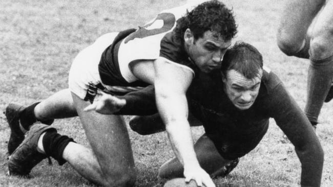 Port Adelaide’s Mark Williams tackles Norwood’s David Payne. Pic: Lisa Jacka.