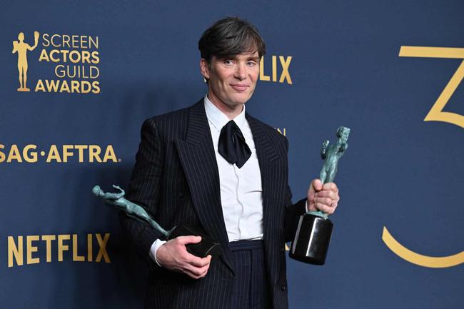 Irish actor Cillian Murphy poses in the press room with the awards for Outstanding Performance by a Male Actor in a Leading Role in a Motion Picture and Outstanding Performance by a Cast in a Motion Picture for "Oppenheimer" during the 30th Annual Screen Actors Guild awards at the Shrine Auditorium in Los Angeles, February 24, 2024. (Photo by Robyn BECK / AFP)