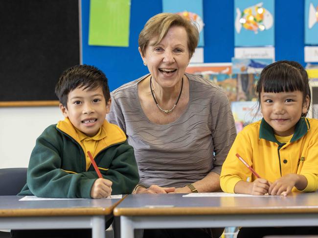 27th July, 2023: Teacher Anita Hudd with reception students Pranish (6) and Abigail (5), has just clocked up 50 years of teaching in SA primary schools. Pic of her with young students at Salisbury P.S Picture by Kelly Barnes