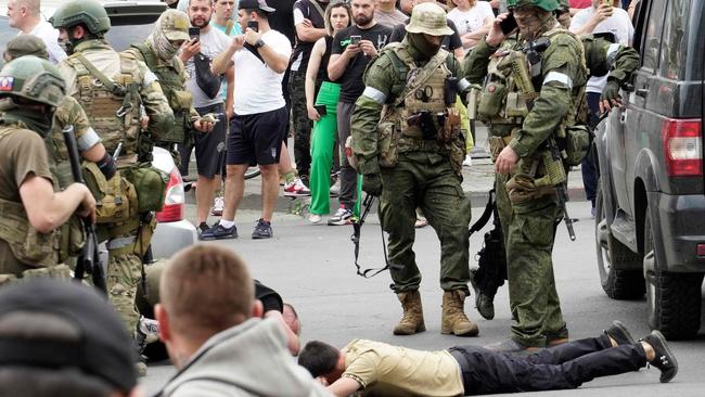 Members of the Wagner Group detain a man in the Russian city of Rostov-on-Don over the weekend. Picture: AFP