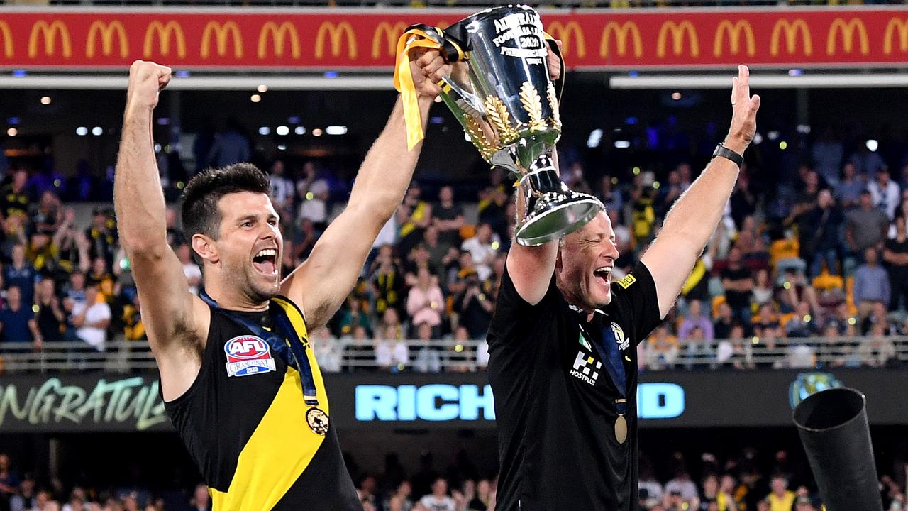 Trent Cotchin and Damien Hardwick hold up the only AFL premiership cup won outside Victoria.