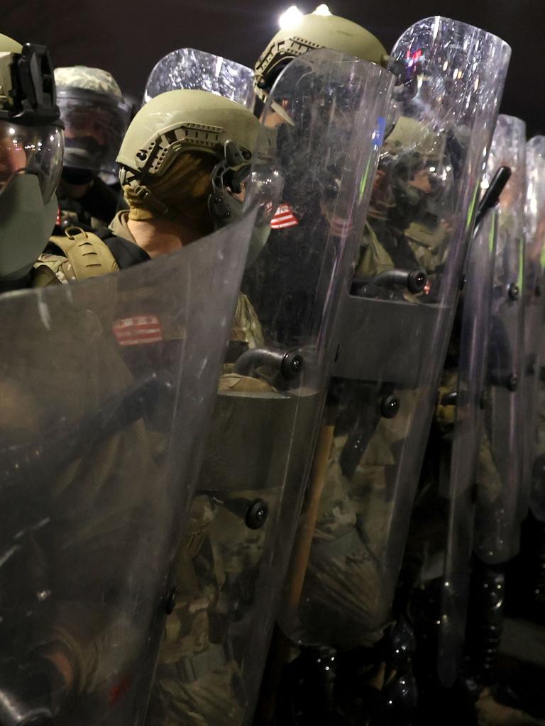 National Guard officers with riot shields outside the building. Picture: Tasos Katopodis/Getty Images