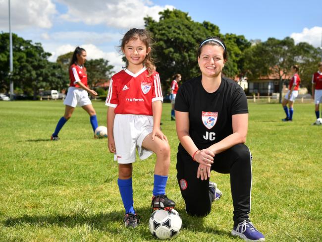 Pagewood Botany Football Club members Erin Jones and Coach Julia Chernoukha pose for a photo at Jellicoe Park in Pagewood, Sydney, Saturday, Nov. 11, 2017. (AAP Image/Joel Carrett)