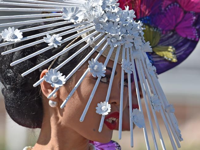 Competitors from around the world prepare for the annual Fashion on the Field competition at Flemington Racecourse on Melbourne Cup day in Melbourne on November 3, 2015. Picture: AFP PHOTO/Paul CROCK