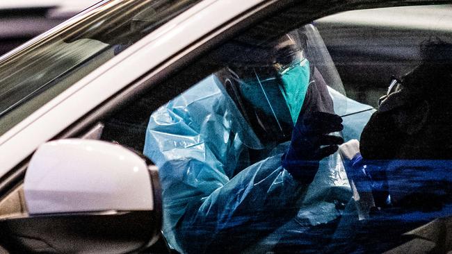 SYDNEY, AUSTRALIA - NewsWire Photos July 18, 2021: Covid testing and cars lined up at Fairfield covid drive through clinic. Picture: NCA NewsWire / Flavio Brancaleone