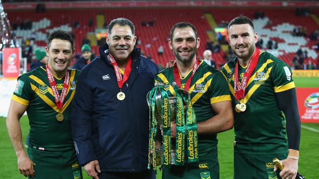 Cooper Cronk, Mal Meninga, Cameron Smith and Darius Boyd celebrate with the trophy.