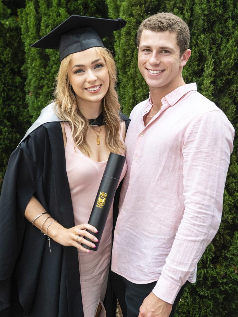 Bachelor of Business graduate Madeleine Scott is congratulated by John Stevens at the UniSQ graduation ceremony at Empire Theatres, Tuesday, December 13, 2022. Picture: Kevin Farmer