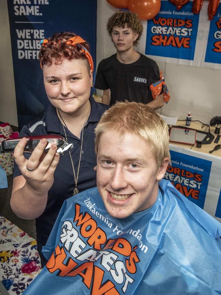 Bella Mauger shaves Sam Joyce's head for the World's Greatest Shave. Monday, June 6, 2022. Picture: Nev Madsen.