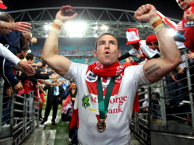 Clive Churchill Medal winner Darius Boyd leaves the field after the St George Illawarra Dragons grand final victory at ANZ Stadium.