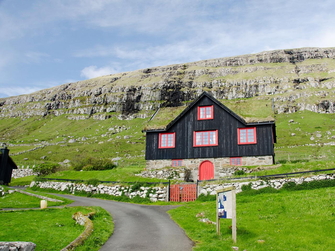 Kingdom of Denmark, Faroe Islands (aka Foroyar). Historic outdoor museum, Kirkjubor Village. Old farm house with sod roof.