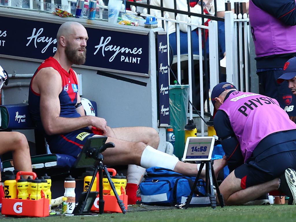 Max Gawn receives treatment on his ankle. Picture: Graham Denholm/AFL Photos/via Getty Images.