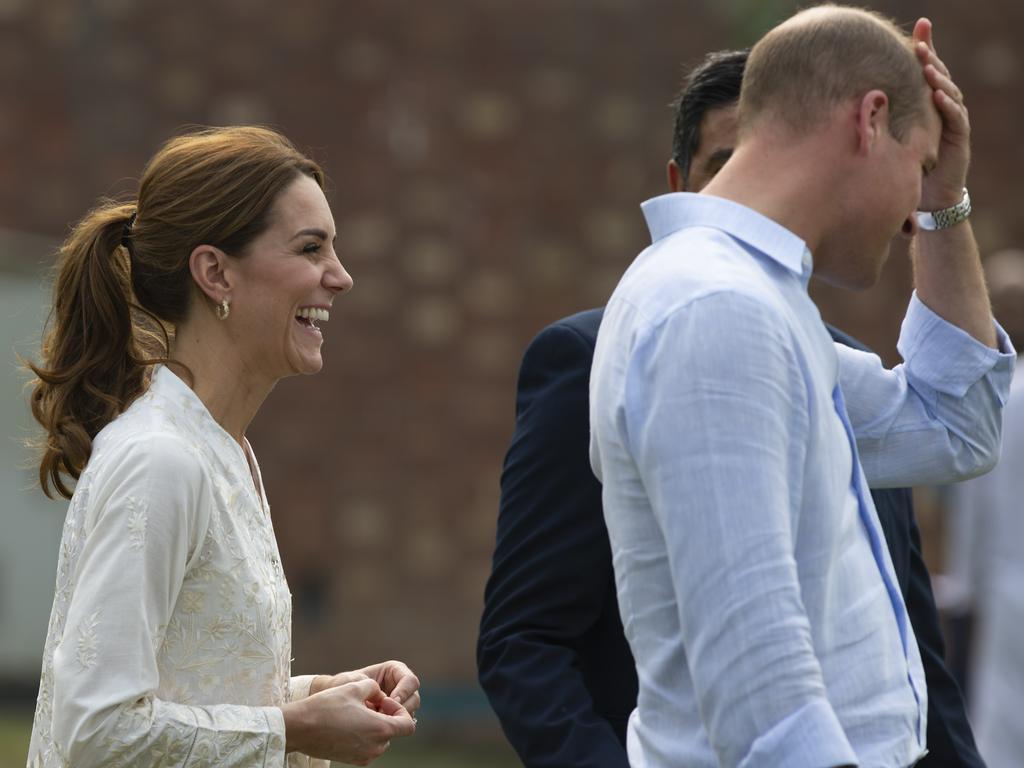 Kate laughs and gestures about her cricket skills before what will be a more serious visit to a hospital where children are being treated for cancer. Picture: AP Photo/B.K. Bangash