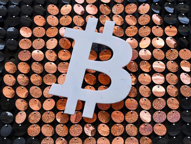 A Dutch national IS accused of being a “money mule” for a sophisticated crime syndicate that stole more than $3 million from Australian bank accounts, converted it to cryptocurrency and then shipped it offshore. (Photo by NICOLAS TUCAT / AFP)