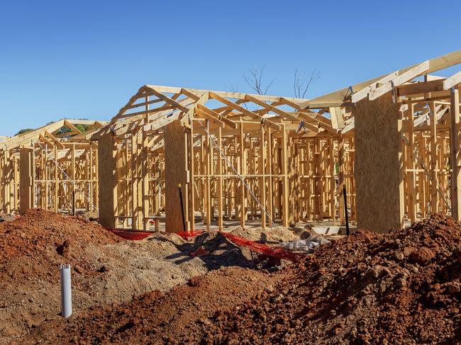 new suburban homes currently under construction in row