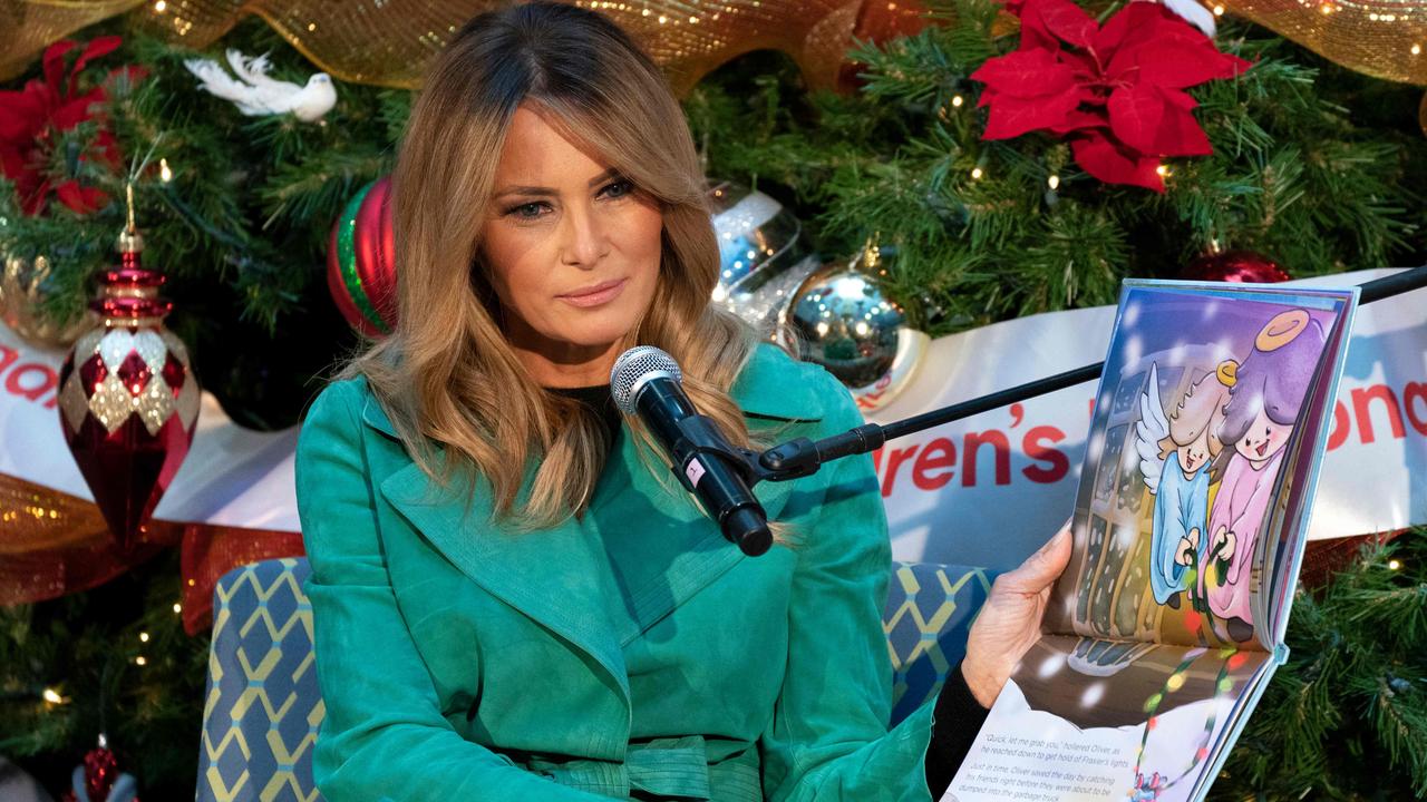 First lady Melania Trump reads a Christmas book titled, ‘Oliver the Ornament Meets Marley and Joan and Abbey’ at Children's National Hospital. Picture: Jacquelyn Martin / POOL / AFP