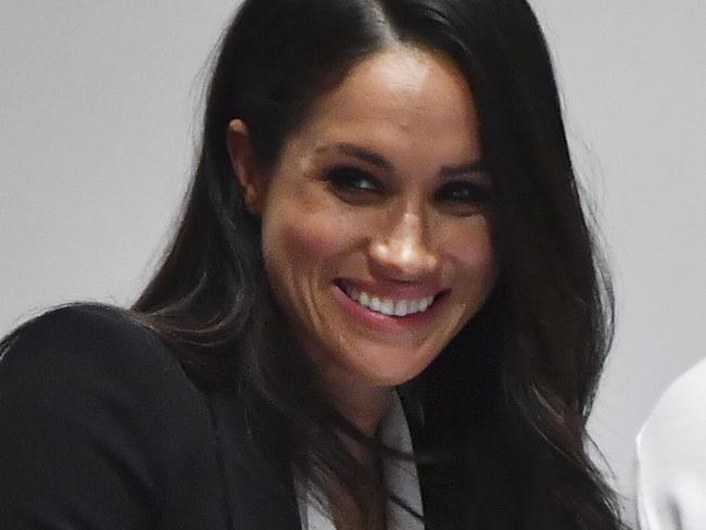 Meghan Markle, helps with the award presentations as she attends the annual Endeavour Fund Awards at Goldsmiths' Hall in London, Thursday Feb. 1, 2018.  Britain's Prince Harry and his fiancee Meghan Markle attended the second annual Endeavour Fund Awards ceremony marking the sporting and adventure achievements of wounded, injured and sick military veterans as part of their recovery and rehabilitation. (Ben Stansall/pool via AP)