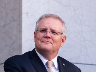 CANBERRA, AUSTRALIA - MAY 08: Prime Minister Scott Morrison speaks during a press conference following a National Cabinet meeting on May 8, 2020 in Canberra, Australia. Prime Minister Scott Morrison has outline a new plan agreed to by the National Cabinet to start easing restrictions imposed in response to the COVID-19 pandemic. The three-step plan aims to deliver a "COVID-19 safe economy" by allowing restaurants and cafes to reopen, then allowing 20-person gatherings before later loosening restrictions to allow 100-person gatherings and interstate travel. Individual state and territory governments will be in charge how quickly they move through the stages based on the status of the disease. (Photo by Rohan Thomson/Getty Images)