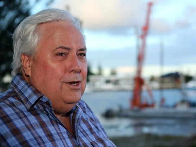 Clive Palmer talks to the media on the Esplanade at Paradise Point, Gold Coast. Pic Jono Searle.