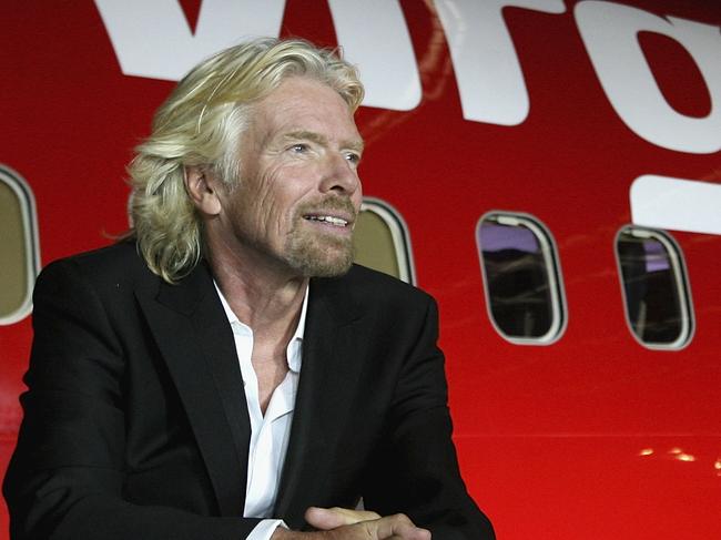 MELBOURNE, AUSTRALIA - SEPTEMBER 12:  Sir Richard Branson celebrates Virgin Blue's 10th Anniversary in Australia at Melbourne Airport on September 12, 2010 in Melbourne, Australia.  (Photo by Robert Prezioso/Getty Images)