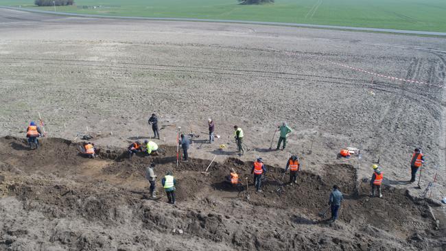 Archaeologists search for coins and jewellery after a medieval silver treasure was found near Schaprode, Germany. Picture: Stefan Sauer