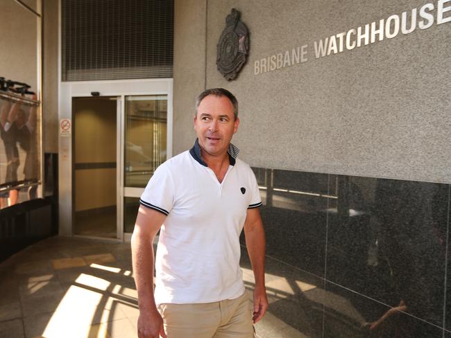 Clive Palmer’s media adviser Andrew Crook leaves the Brisbane police watch house on bail last month after being arrested over his involvement in the attempted abduction of a senior NAB executive in Indonesia.
