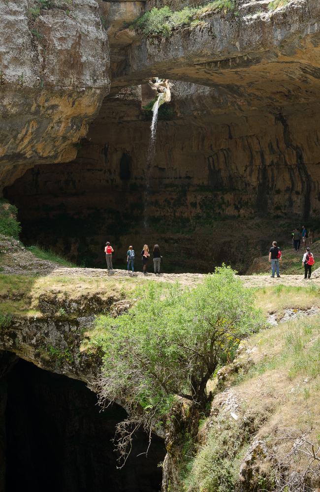 Visitors soak up the waterfall. Picture: Institut francais du proche