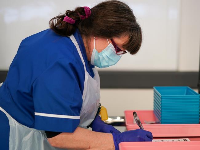 A member of the medical team records details after drawing up the AstraZeneca vaccine in Penrith, England. Picture: Getty Images