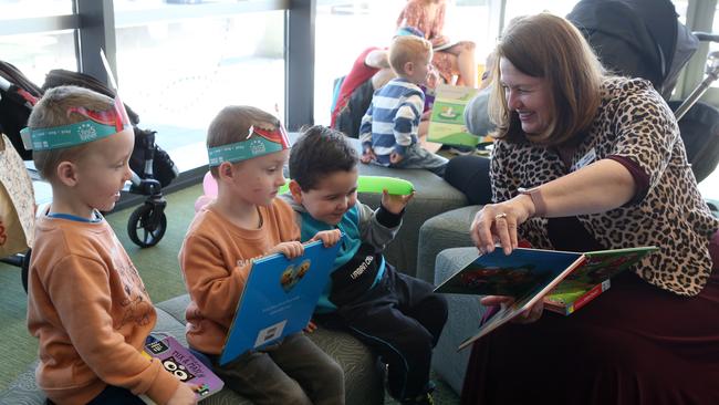 Ipswich Mayor Teresa Harding in the new Ipswich Children's Library with Joseph and Jethro Crowe and Ethan Carter.