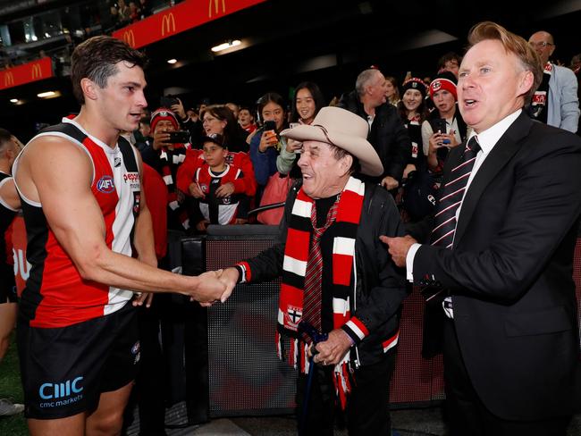 MELBOURNE, AUSTRALIA - APRIL 03: Jack Steele of the Saints shakes hands with Molly Meldrum during the 2022 AFL Round 03 match between the St Kilda Saints and the Richmond Tigers at Marvel Stadium on April 03, 2022 In Melbourne, Australia. (Photo by Dylan Burns/AFL Photos via Getty Images)