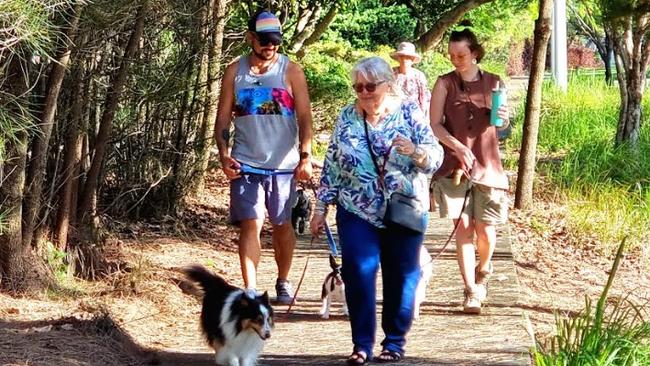 Residents walking their dogs at Southport's Carey Park, the site for a future indoor arena.