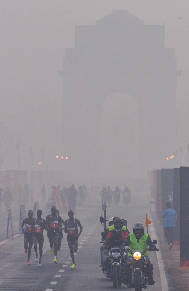 Participants make their way along Rajpath during the Delhi Half Marathon in New Delhi yesterday. Picture: Chandan Khanna/AFP