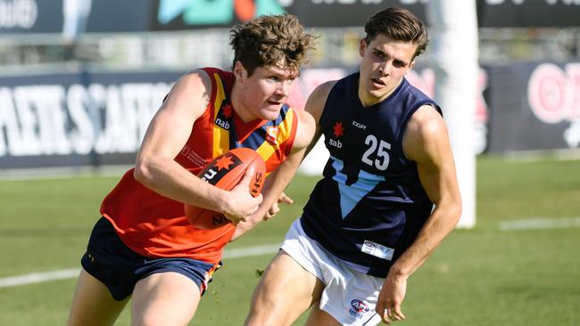 South Australia’s Harry Schoenberg breaks away from Vic Metro’s Finn Maginness at the Under-18 championships in June. Picture: Morgan Sette/AAP