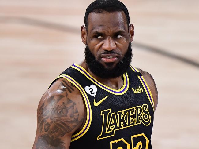 LAKE BUENA VISTA, FLORIDA - OCTOBER 02: LeBron James #23 of the Los Angeles Lakers reacts during the first half against the Miami Heat in Game Two of the 2020 NBA Finals at AdventHealth Arena at ESPN Wide World Of Sports Complex on October 02, 2020 in Lake Buena Vista, Florida. NOTE TO USER: User expressly acknowledges and agrees that, by downloading and or using this photograph, User is consenting to the terms and conditions of the Getty Images License Agreement.   Douglas P. DeFelice/Getty Images/AFP == FOR NEWSPAPERS, INTERNET, TELCOS & TELEVISION USE ONLY ==