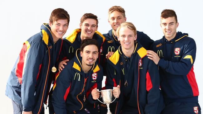 Draft hopefuls Izak Rankine and Jack Lukosius, middle, with Hugo Munn, Connor Rozee, Jackson Hately and Luke Valente together with South Australia’s national championship trophy. Picture: Tait Schmaal