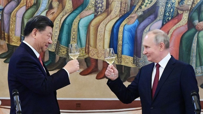 Russian President Vladimir Putin and China's President Xi Jinping in 2023, making a toast during a reception after their talks at the Kremlin. Picture: AFP