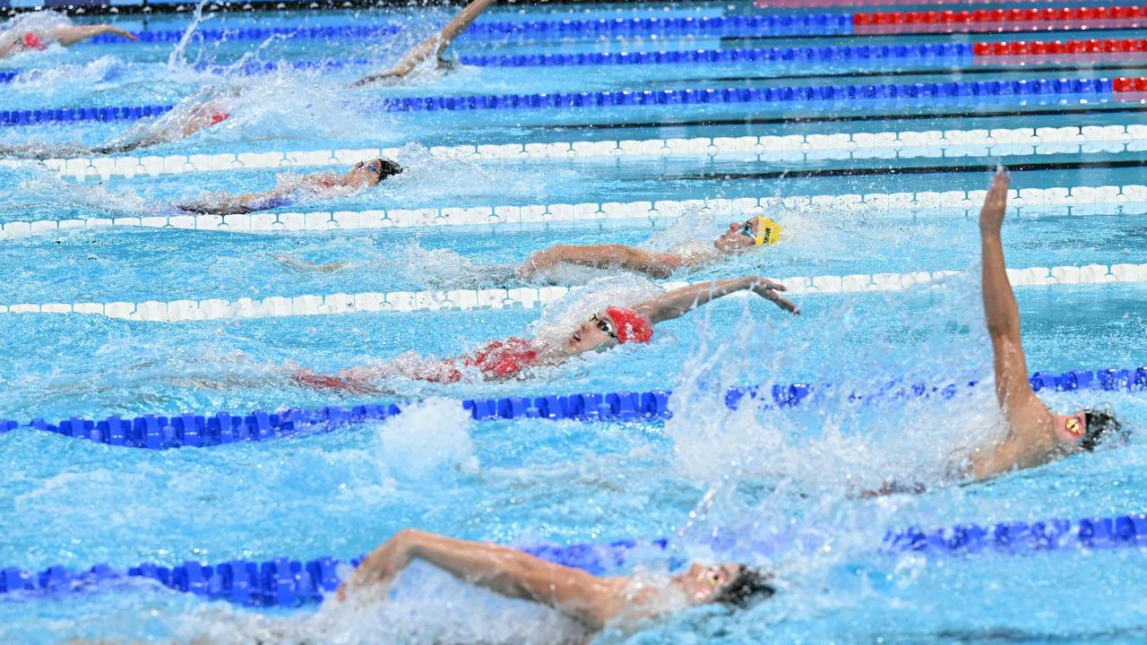 Australia's Kaylee McKeown, centre, and China's Peng Xuwei just below, during the women's 200m backstroke final. Picture: Jonathan Nackstrand/AFP