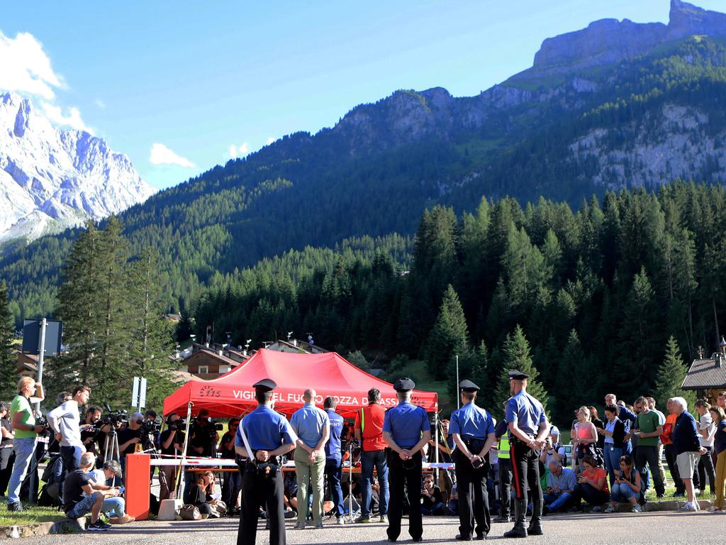 Police officers stand guard in Canazei, two days after the collapse. Picture: Pierre Teyssot/AFP