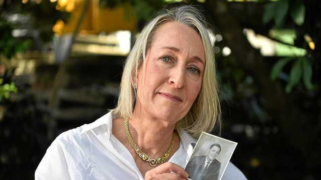 Lyndal Hughes holds a picture of her father John who is very ill in hospital. Picture: Warren Lynam