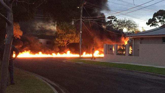 A fire blazed down the street after the shocking landing. Picture: 7 News