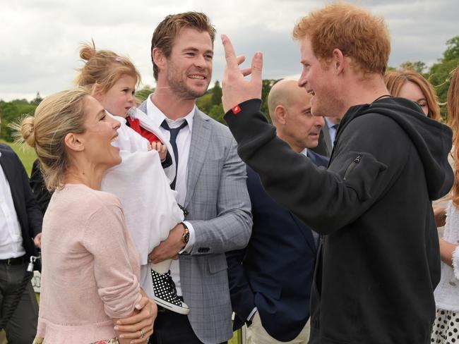 Horsing around ... Elsa Pataky, India Rose Hemsworth, Chris Hemsworth and Prince Harry talk animatedly. Picture: Getty