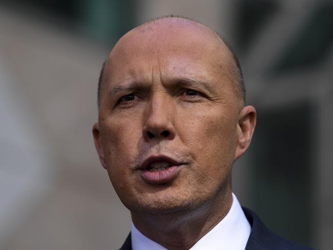 Former Australian Home Affairs Minister Peter Dutton speaks to the media during a press conference at Parliament House in Canberra, Tuesday, August 21, 2018.  (AAP Image/Lukas Coch) NO ARCHIVING