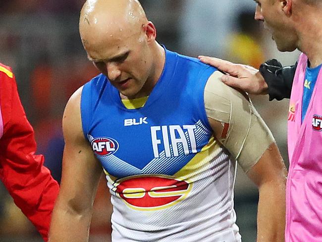 Gold Coast Suns' Gary Ablett is consoled by former premierhsip teammate Steve Johnson after the GWS Giants had huge win over Gold Coast Suns at Spotless Stadium. Picture. Phil Hillyard