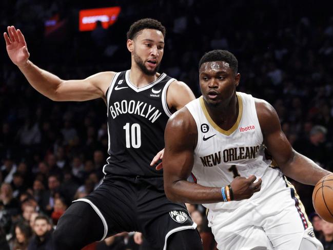 NEW YORK, NEW YORK - OCTOBER 19: Zion Williamson #1 of the New Orleans Pelicans dribbles against Ben Simmons #10 of the Brooklyn Nets during the first half at Barclays Center on October 19, 2022 in the Brooklyn borough of New York City. NOTE TO USER: User expressly acknowledges and agrees that, by downloading and or using this photograph, User is consenting to the terms and conditions of the Getty Images License Agreement.   Sarah Stier/Getty Images/AFP