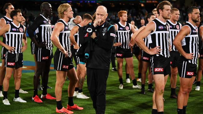 ADELAIDE, AUSTRALIA - APRIL 01: Dejected Port players and Ken Hinkley coach of Port Adelaide  after losing  the round three AFL match between Port Adelaide Power and Adelaide Crows at Adelaide Oval, on April 01, 2023, in Adelaide, Australia. (Photo by Mark Brake/Getty Images)