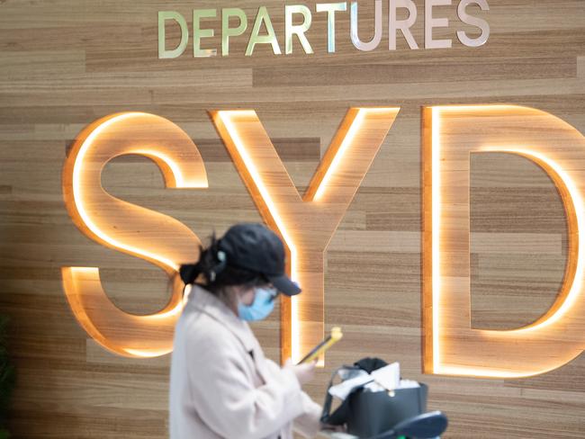 SYDNEY, AUSTRALIA - NewsWire Photos December 9, 2020: A passenger wearing a protective face mask in the Departures hall at Sydney International Airport. Picture: NCA NewsWire / James Gourley