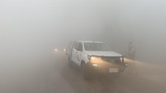 Heavy fog along Lee Point Rd this morning. Picture: Graham Havens