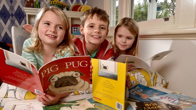 Alice, 6, Tom, 8, and Isabelle Dunckley, 4, hit the Great Australian Storybooks. Picture: Jay Town